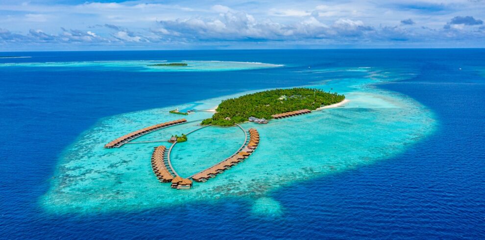 Aerial view of Ayada Maldives with overwater villas stretching out into the ocean