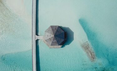 Aerial view of an overwater pavilion at Jawakara Dheru Island