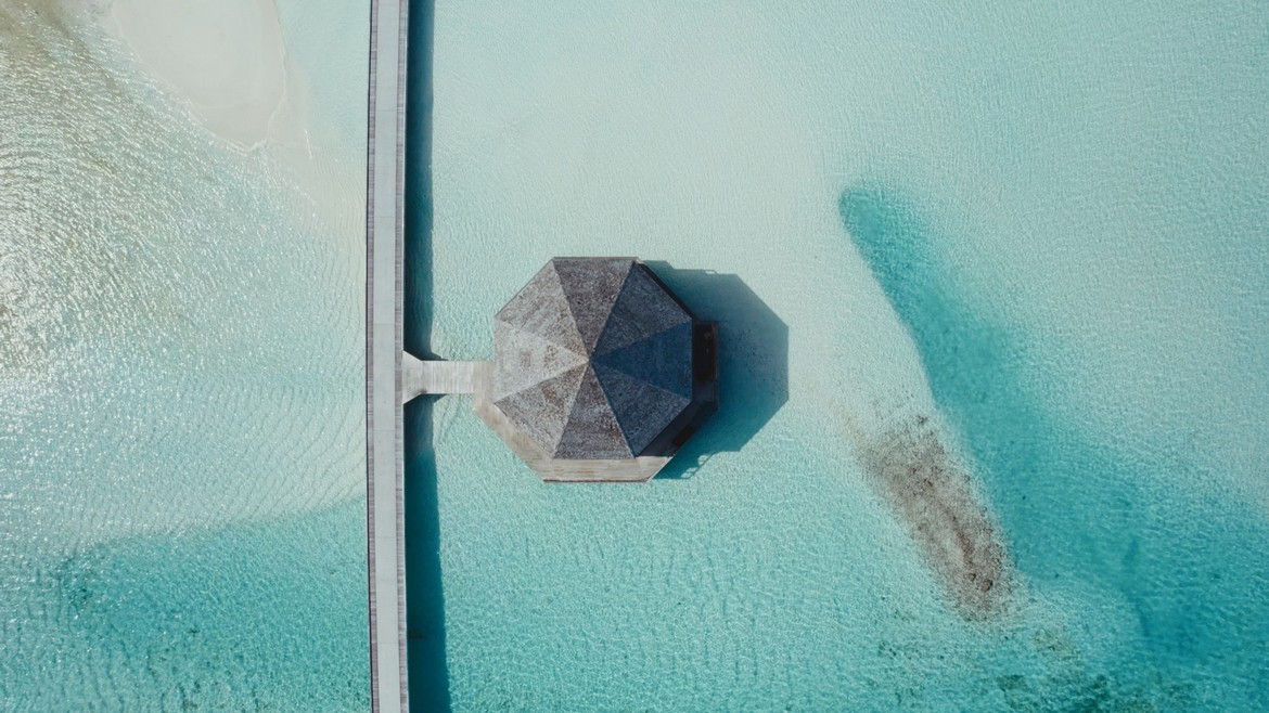 Aerial view of an overwater pavilion at Jawakara Dheru Island