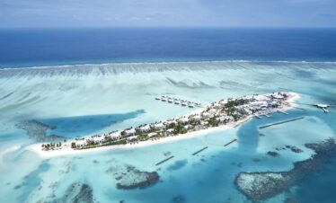 Aerial view of the island and surrounding ocean at Riu Atoll