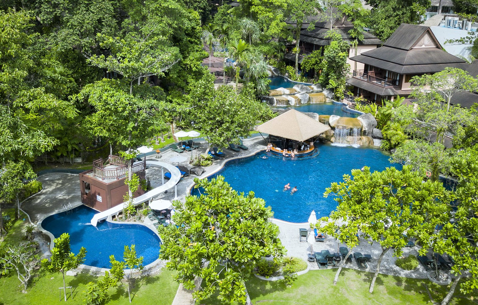 Aerial view of the pool area at Khao Lak Merlin with surrounding tropical vegetation