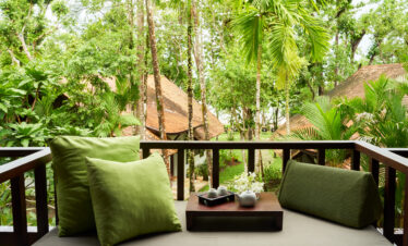 Balcony view overlooking The Tubkaak Krabi resort with tropical greenery
