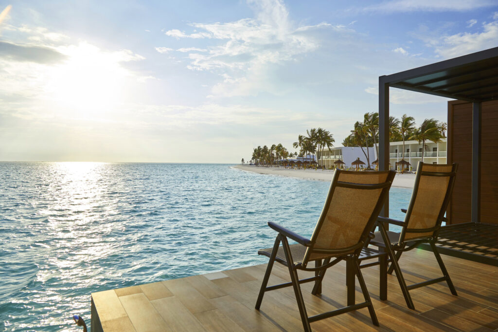 Beachfront view with sun loungers overlooking the ocean at Riu Atoll