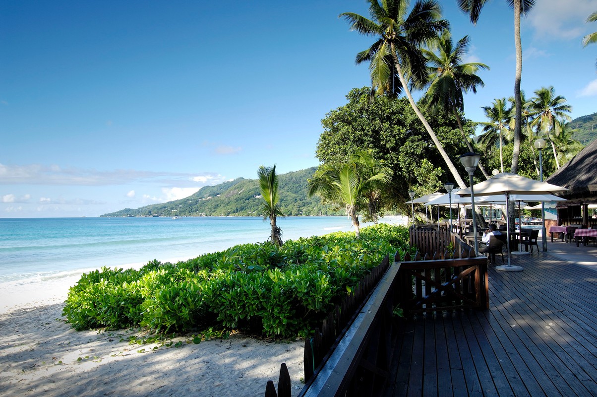 Beachfront with lush vegetation at Berjaya Beau Vallon