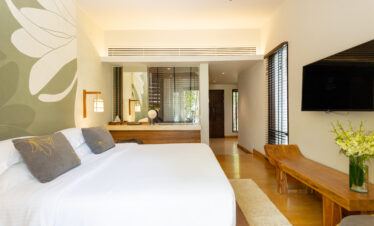 Bright and modern bedroom interior at The Tubkaak Krabi with garden views