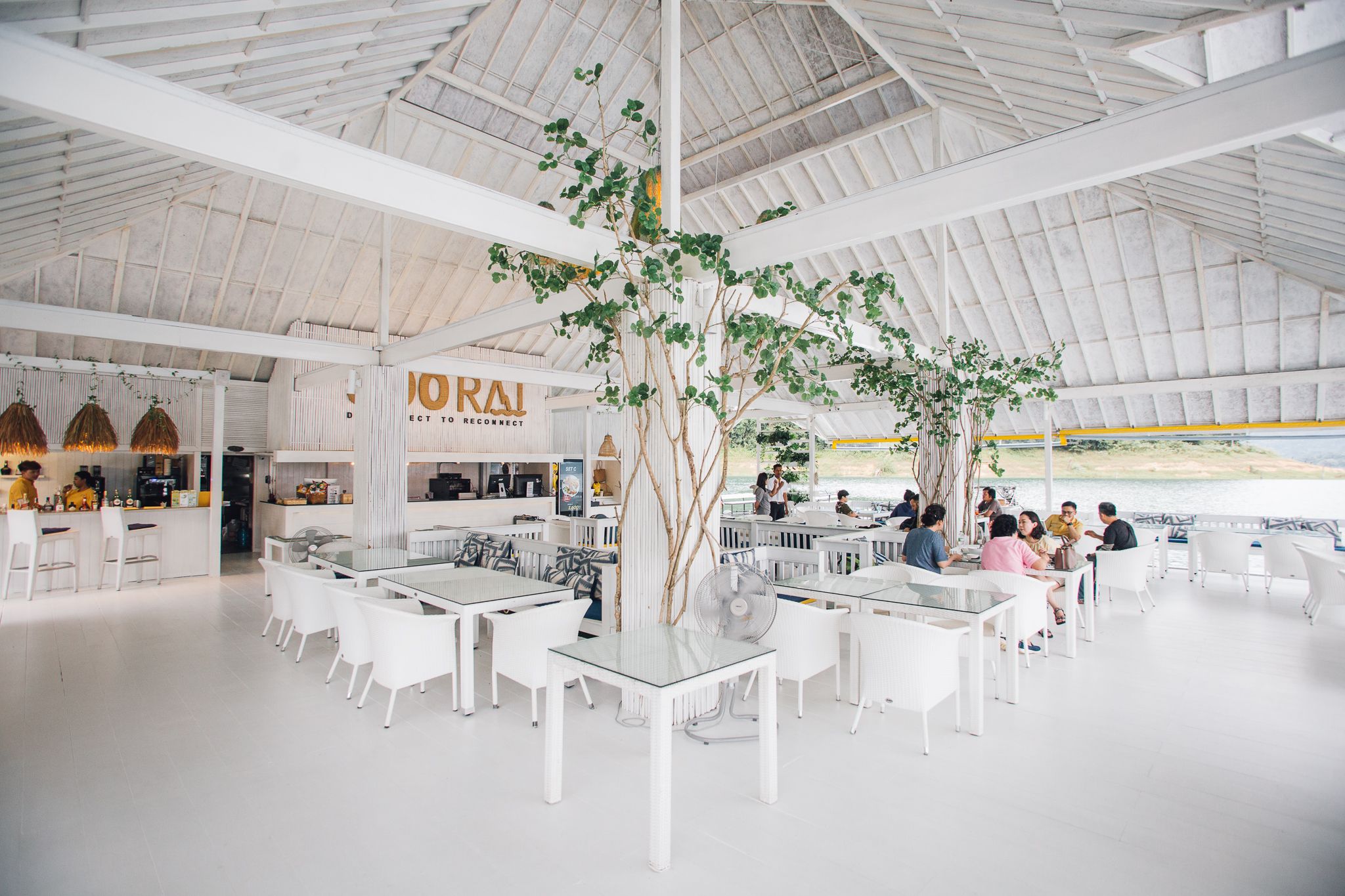 Bright and modern restaurant with lake views at 500Rai Floating Resort