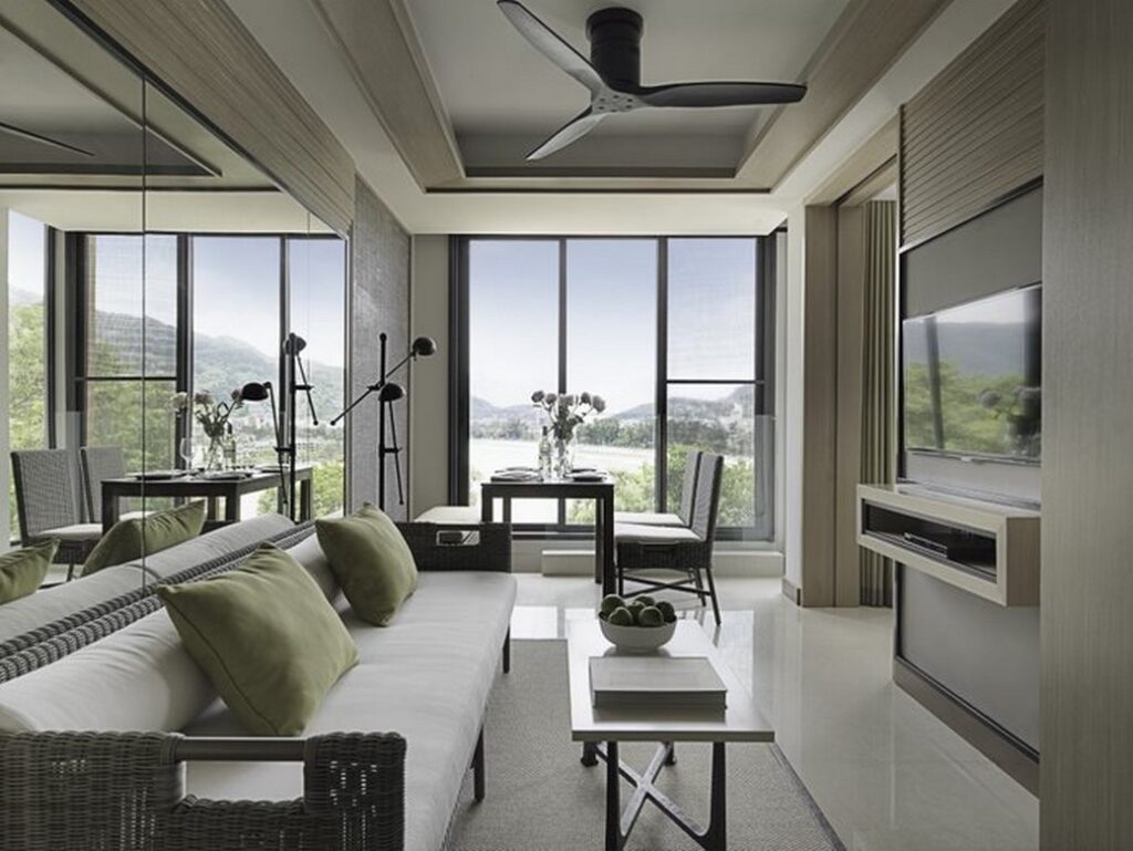 Bright living area with green accents overlooking the scenic view from Amari Phuket