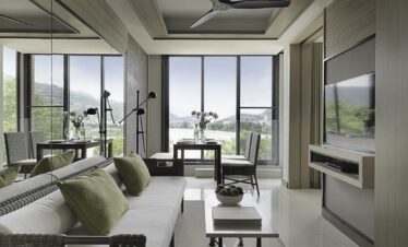 Bright living area with green accents overlooking the scenic view from Amari Phuket