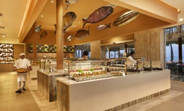 Buffet area with chefs preparing dishes at Riu Palace