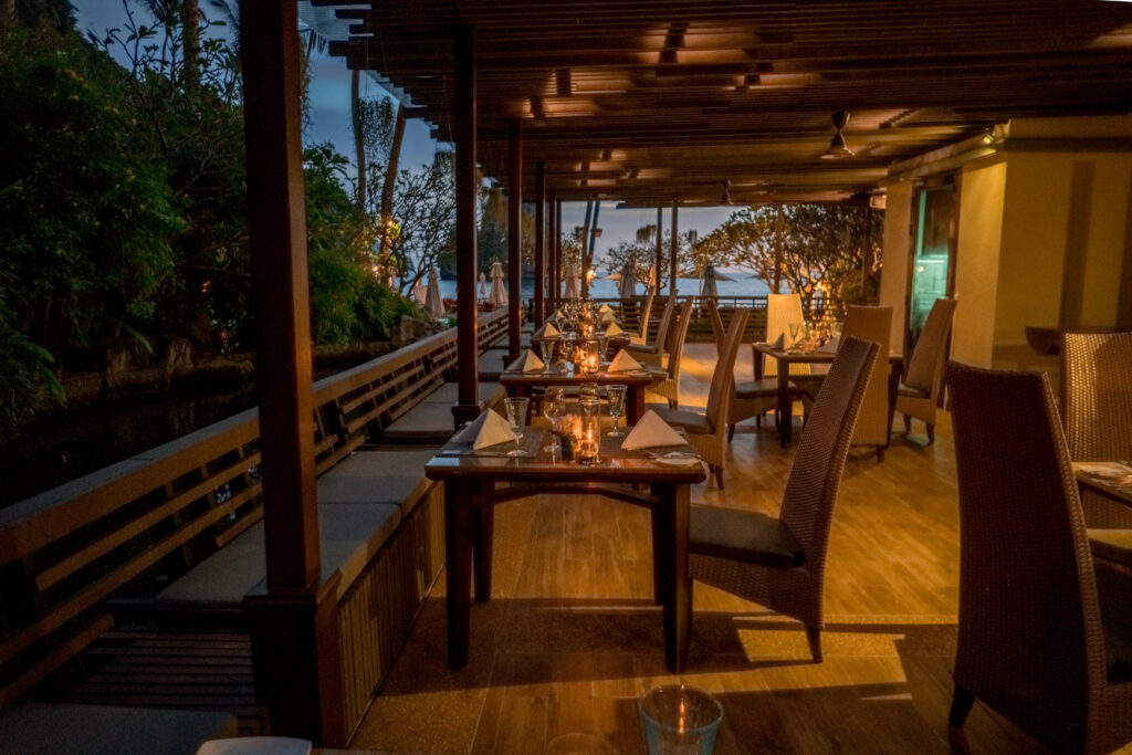 Candlelit dining area at Centara Grand Beach Resort with a view of the ocean