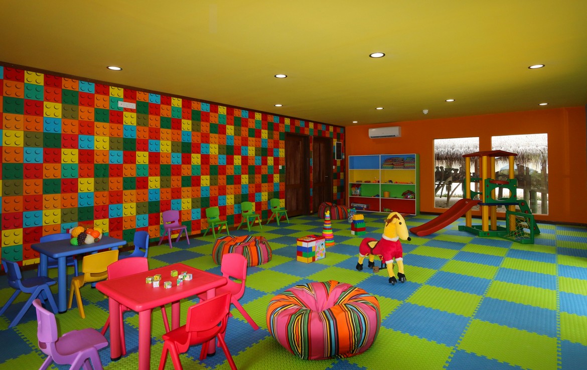 Colorful indoor play area at Meeru Island Resort for kids featuring vibrant decor and a variety of toys