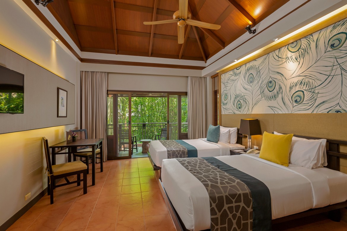 Comfortable twin room with garden view at Khao Lak Merlin featuring modern decor