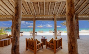 Cozy beachside seating area at You and Me by Cocoon resort overlooking the ocean