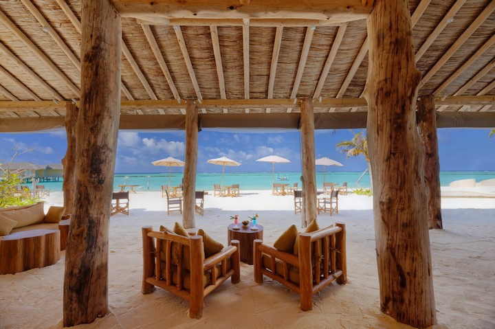 Cozy beachside seating area at You and Me by Cocoon resort overlooking the ocean