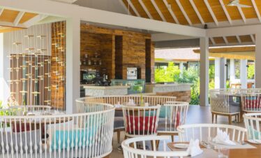 Dhigali open air dining area with modern wooden decor
