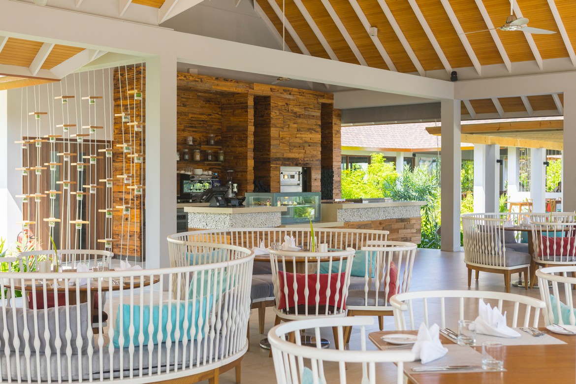 Dhigali open air dining area with modern wooden decor