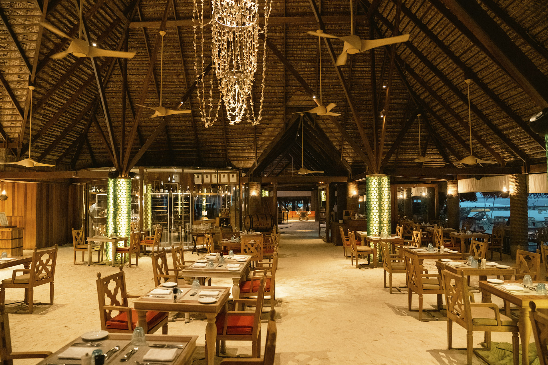 Elegant indoor dining area with a rustic design at Constance Moofushi