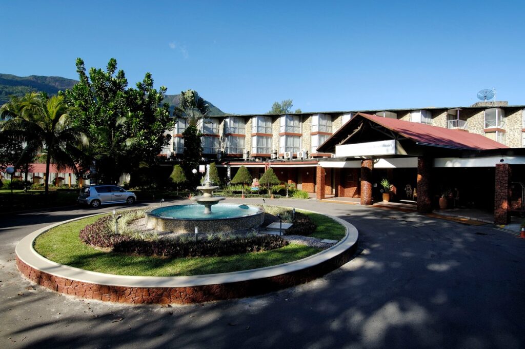 Entrance fountain and hotel facade at Berjaya Beau Vallon