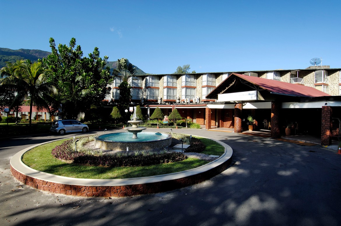 Entrance fountain and hotel facade at Berjaya Beau Vallon