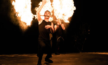Fire performance at Ayada Maldives showcasing skilled performers under a dark sky