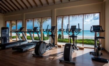 Fitness center at You and Me by Cocoon resort with ocean views from treadmills