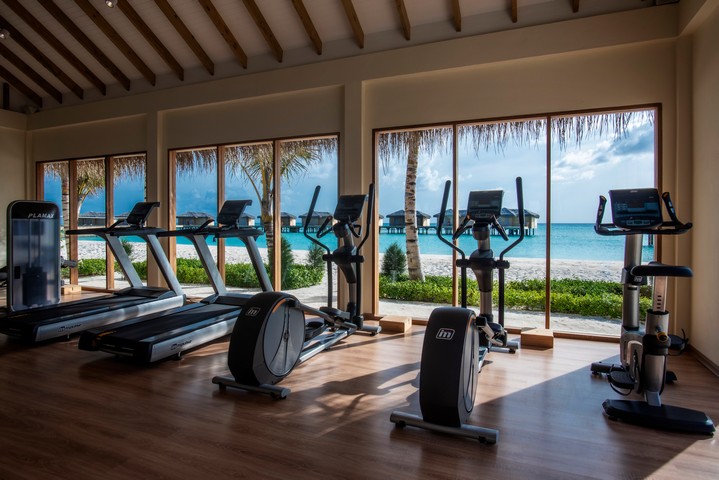 Fitness center at You and Me by Cocoon resort with ocean views from treadmills
