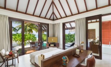 Heritance Aarah villa interior with ocean views through sliding glass doors