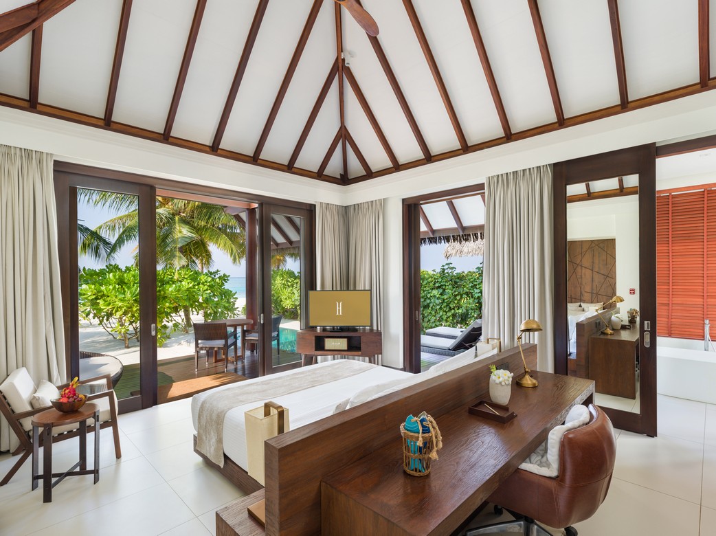 Heritance Aarah villa interior with ocean views through sliding glass doors
