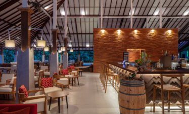 Indoor bar area at Adaaran Meedhupparu with wooden decor