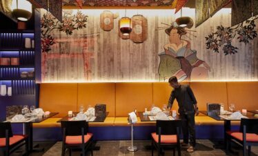 Japanese-themed dining area with artistic wall mural at Riu Palace