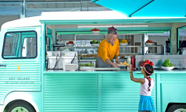 Joy Island food truck serving snacks to guests