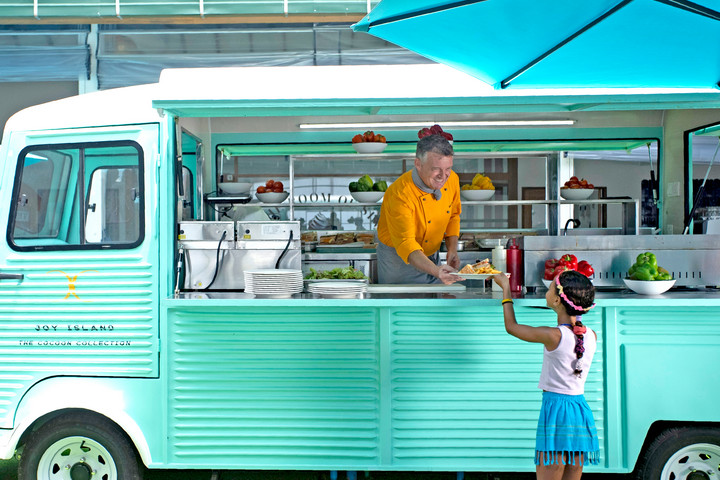 Joy Island food truck serving snacks to guests