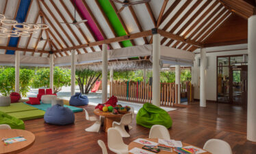 Kids club at Heritance Aarah with colorful ceiling accents and bean bags for fun indoor activities