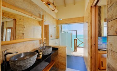 Luxurious bathroom at You and Me by Cocoon with ocean view from the shower
