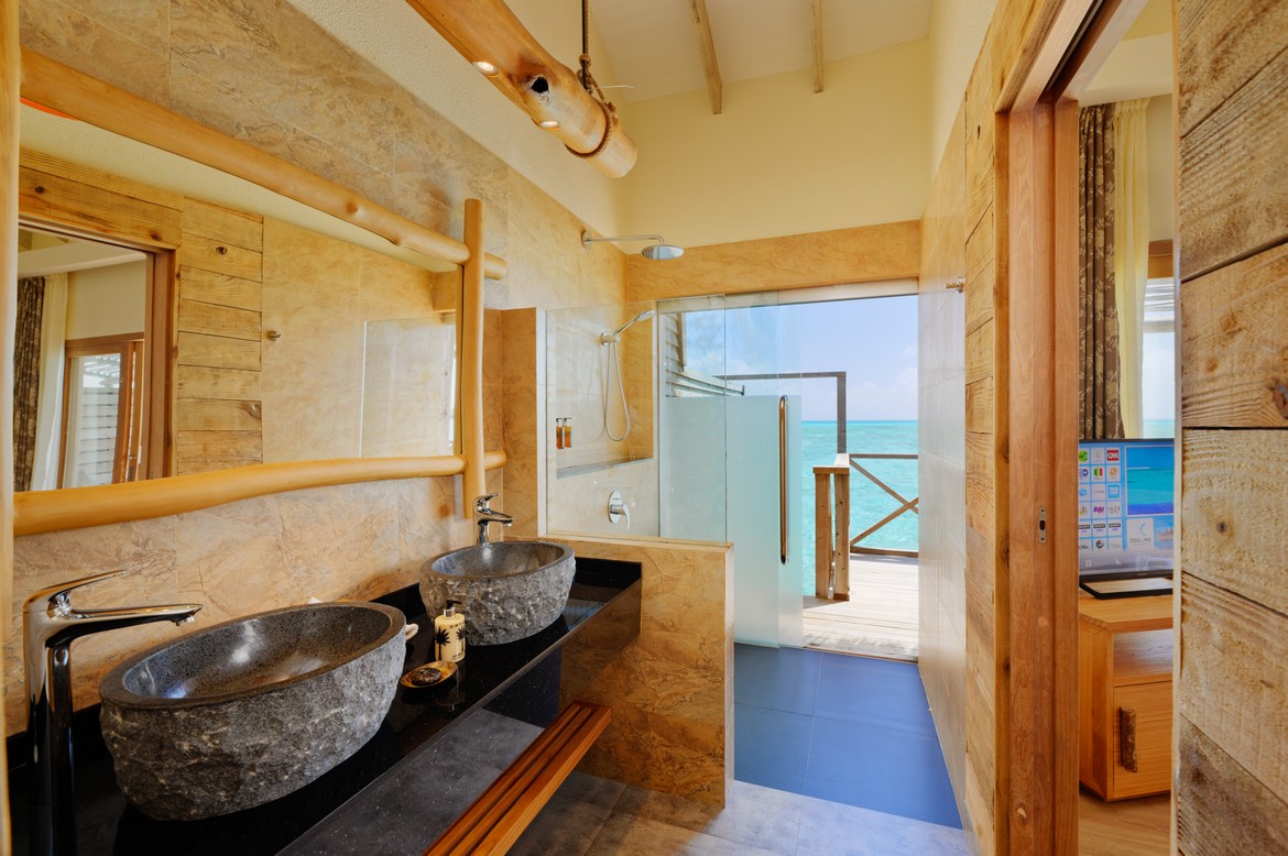 Luxurious bathroom at You and Me by Cocoon with ocean view from the shower