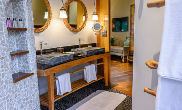 Luxurious bathroom with dual sinks at Constance Moofushi