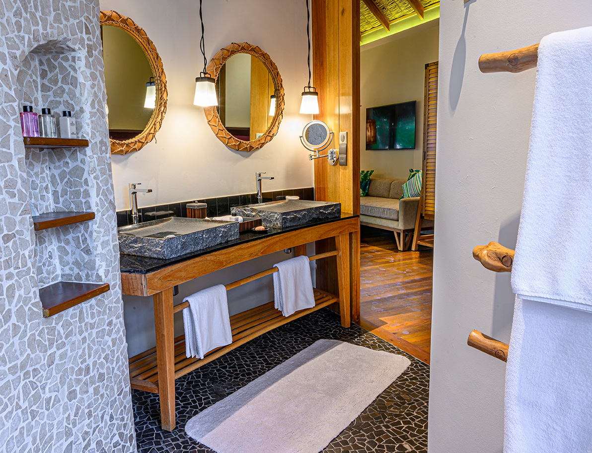 Luxurious bathroom with dual sinks at Constance Moofushi