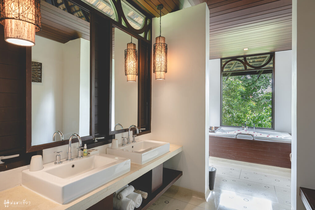 Luxurious bathroom with twin sinks and a soaking tub at The Vijitt Resort