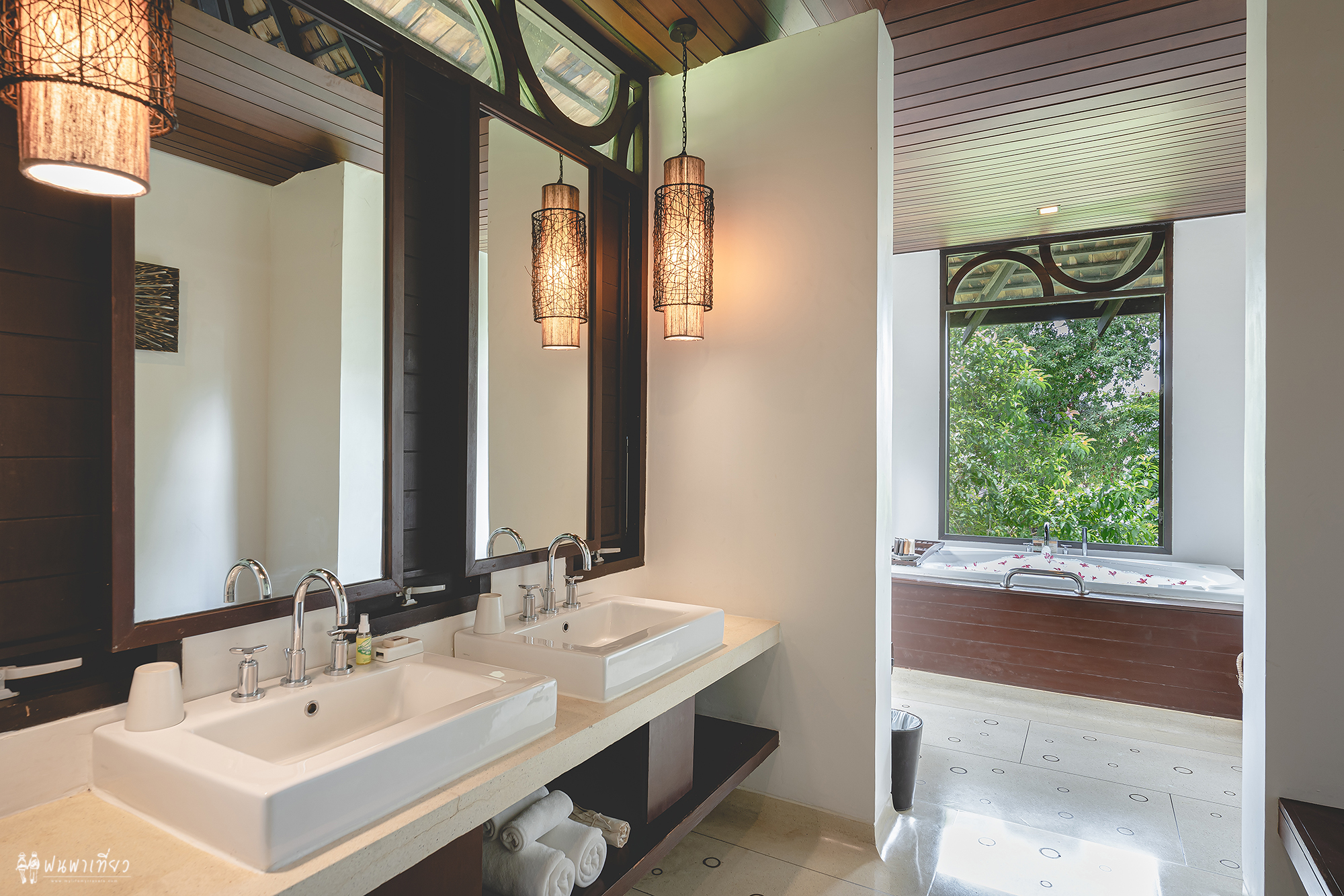 Luxurious bathroom with twin sinks and a soaking tub at The Vijitt Resort