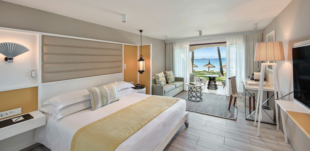 Luxurious beachfront room at Constance Belle Mare Plage with a king-sized bed
