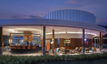 Outdoor bar and lounge area at Avani Chaweng Samui beautifully lit at night with a relaxed atmosphere