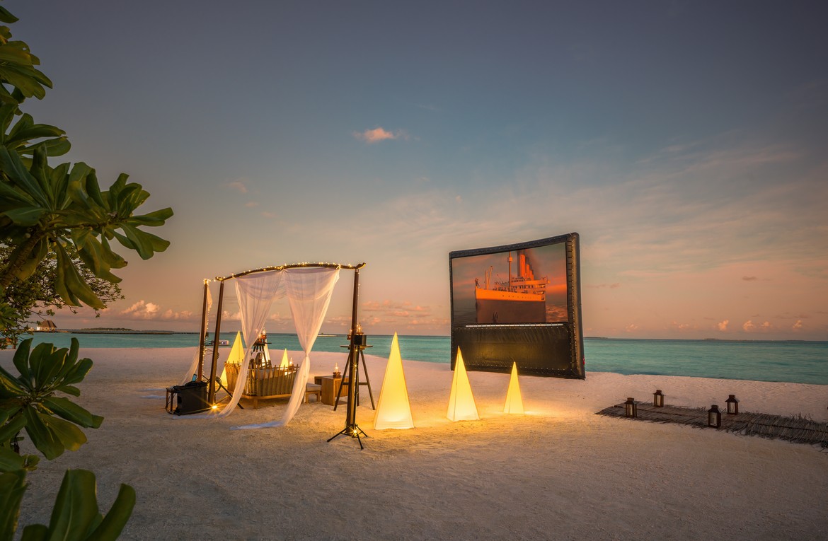 Outdoor beach movie setup at Heritance Aarah with a romantic ambiance at sunset