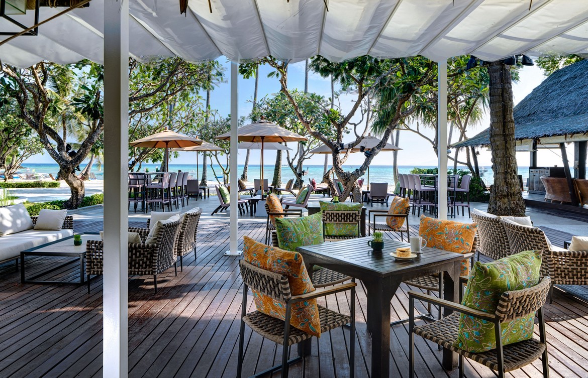 Outdoor dining area with ocean view at Saii Phi Phi Island Village