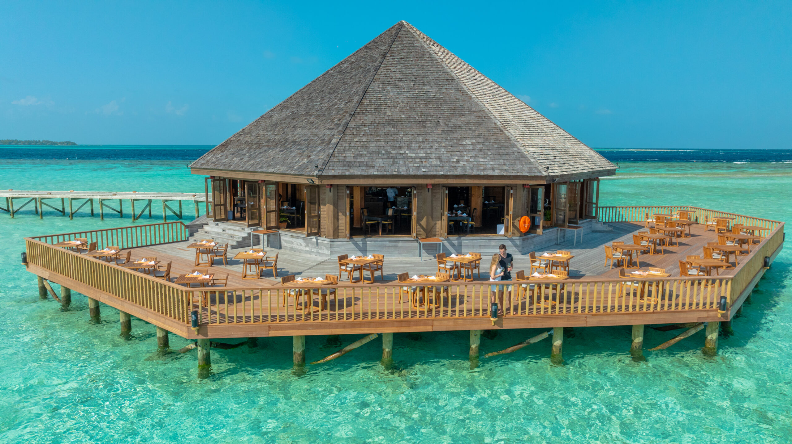 Overwater restaurant at Vilamendhoo offering dining with panoramic ocean views and fresh sea breeze