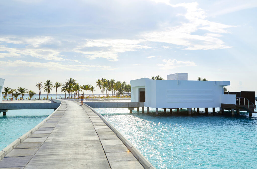 Overwater villa with white architecture at Riu Palace