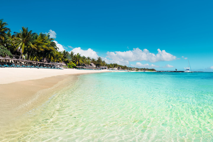 Pristine beach at Constance Belle Mare Plage with clear turquoise waters and white sandy shores