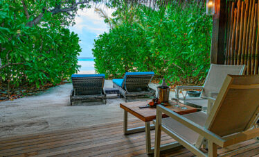 Private beachside terrace with ocean view at Constance Moofushi