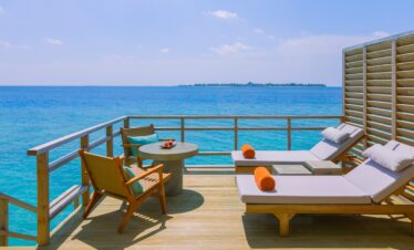 Private deck with ocean views at Dhigali water villa