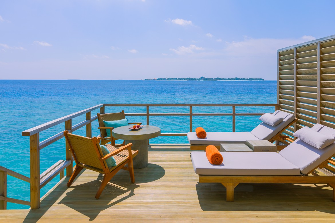 Private deck with ocean views at Dhigali water villa