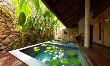 Private outdoor spa area with lily pads at The Tubkaak Krabi